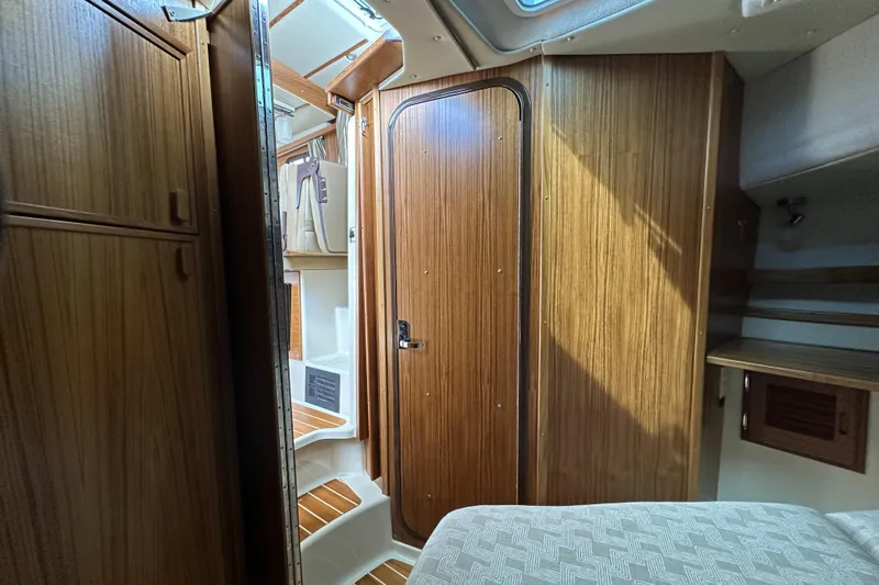  Yacht Photos Pics Interior of 2025 Ranger Tugs R-31 CB, featuring wood paneling and compact design.
