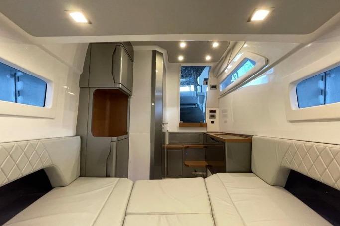 Luxurious interior of 2027 Schaefer V34 yacht with modern furnishings and ambient lighting.