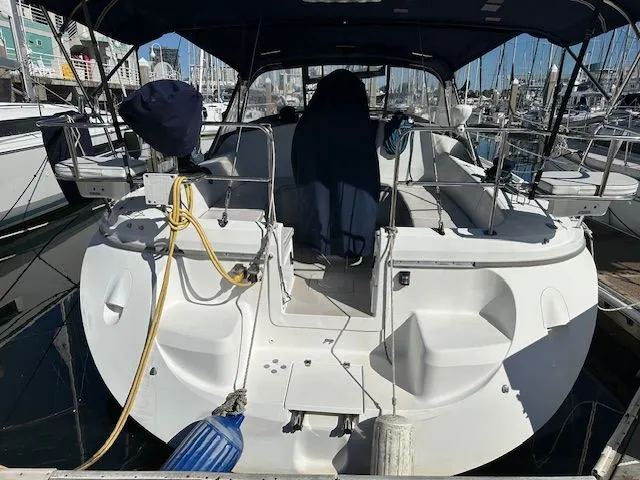 Junebug Yacht Photos Pics Rear view of a 2008 Catalina 350 MkII yacht in harbor.