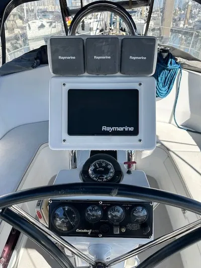 Junebug Yacht Photos Pics Helm of a 2008 Catalina 350 MkII yacht with Raymarine electronics.