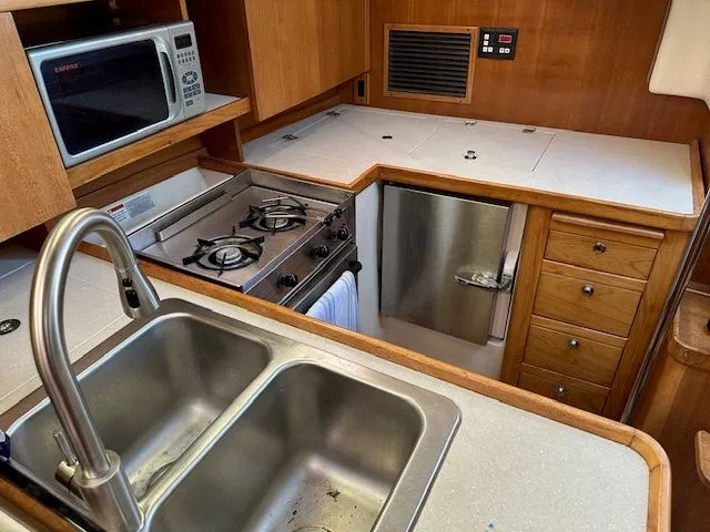 Junebug Yacht Photos Pics 2008 Catalina 350 MkII yacht kitchen with stove and sink.