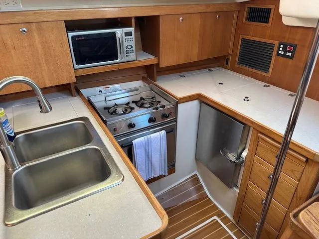 Junebug Yacht Photos Pics 2008 Catalina 350 MkII yacht kitchen with stove and sink.