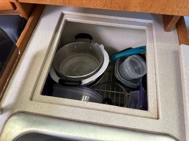 Junebug Yacht Photos Pics Galley area of a 2008 Catalina 350 MkII yacht with dish storage.