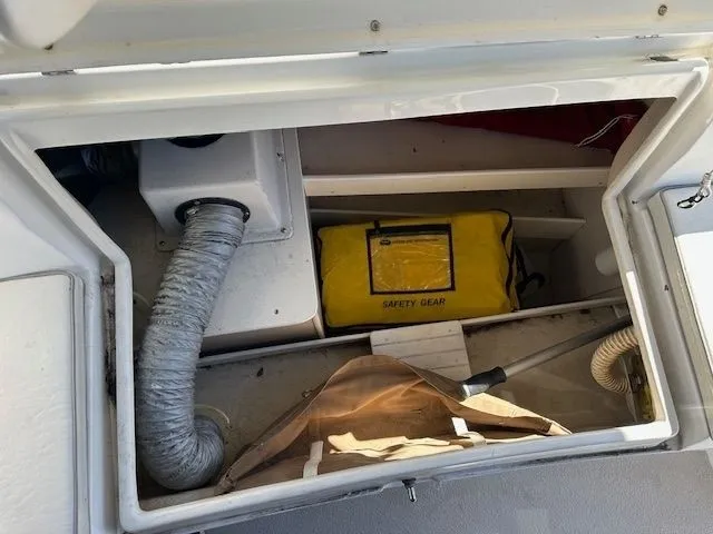 Junebug Yacht Photos Pics Catalina 350 MkII 2008 storage compartment with safety gear.