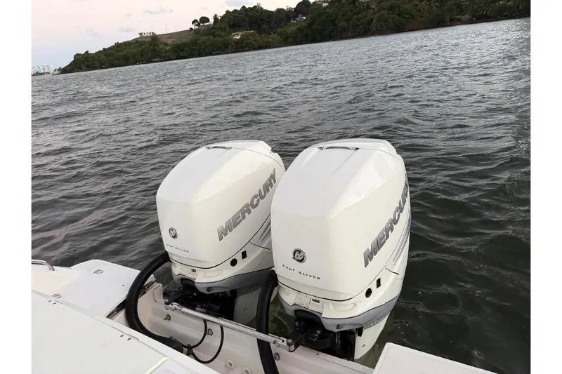  Yacht Photos Pics Twin Mercury outboard engines on a 2017 Boston Whaler 330 Outrage, cruising on a scenic waterway.