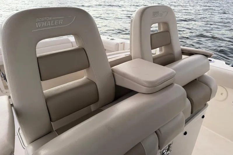  Yacht Photos Pics 2017 Boston Whaler 330 Outrage boat seats with ocean backdrop.