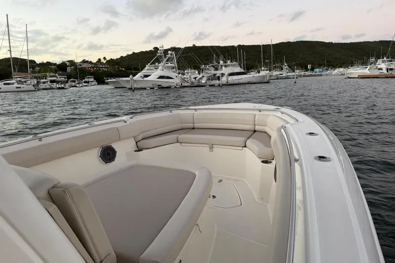 Yacht Photos Pics 2017 Boston Whaler 330 Outrage boat interior at marina, featuring spacious seating.