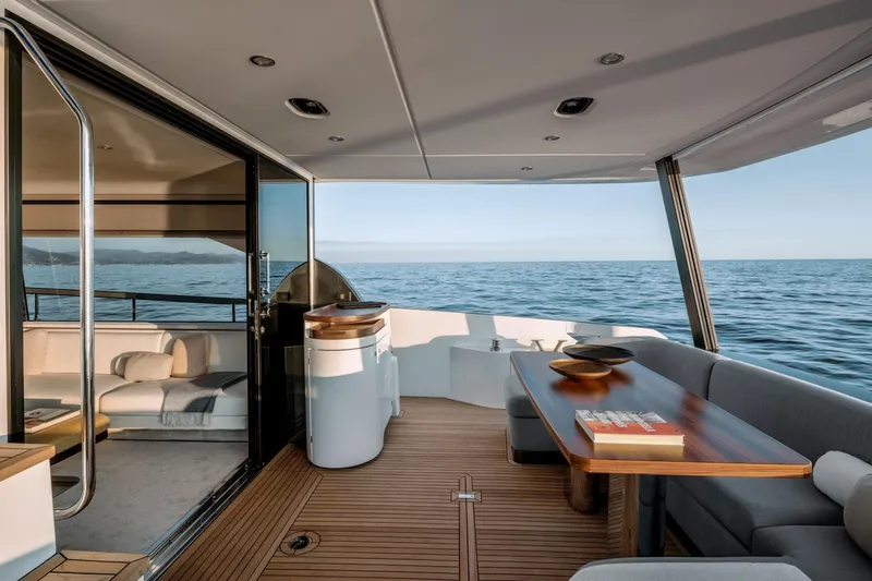  Yacht Photos Pics Luxurious 2024 Azimut 68 yacht deck with elegant seating and ocean view.