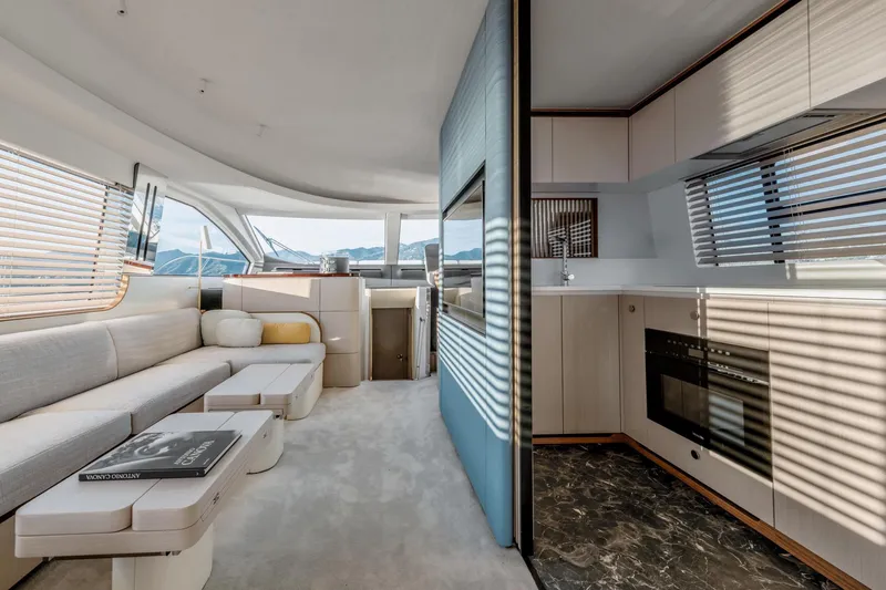  Yacht Photos Pics Luxurious interior of 2024 Azimut 68 yacht with modern kitchen and spacious seating area.