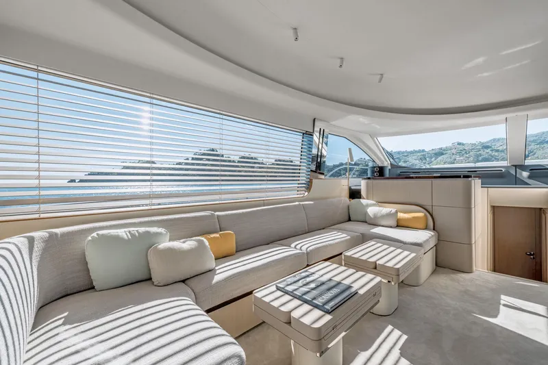  Yacht Photos Pics Luxurious interior of 2024 Azimut 68 yacht with modern seating and panoramic windows.