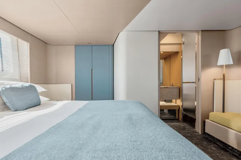  Yacht Photos Pics Luxurious bedroom interior of 2024 Azimut 68 yacht with modern design and elegant furnishings.