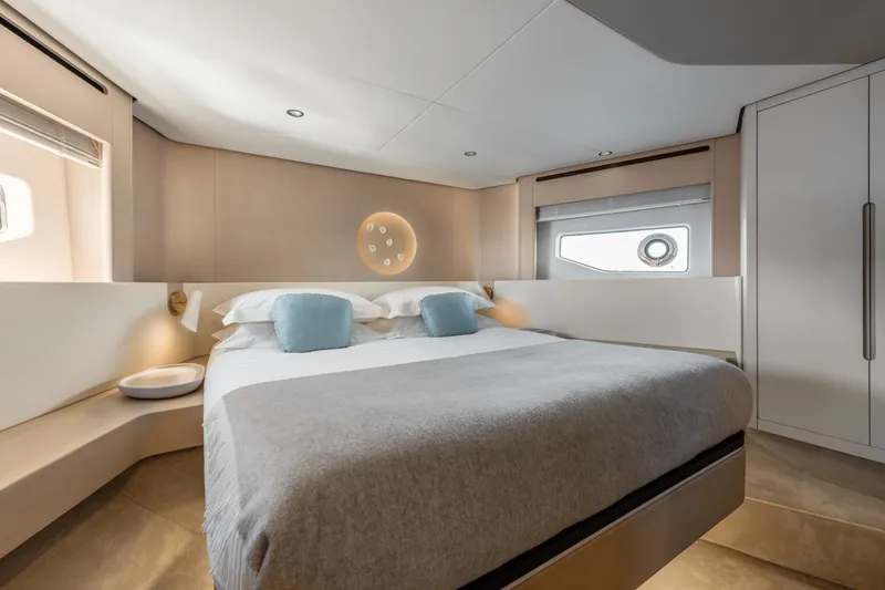 Yacht Photos Pics Luxurious bedroom interior of 2024 Azimut 68 yacht with modern design and elegant furnishings.