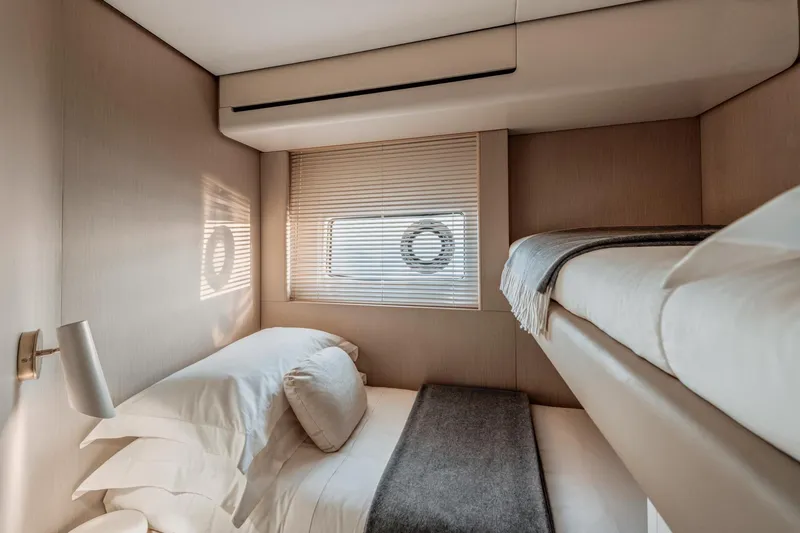  Yacht Photos Pics 2024 Azimut 68 yacht cabin with bunk beds, modern design, and cozy ambiance.