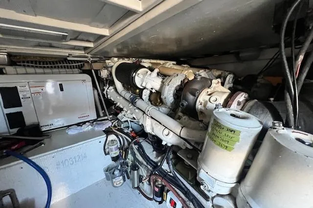 What's Next Yacht Photos Pics Engine room of a 1995 Post 50 Convertible boat, showcasing machinery and components.