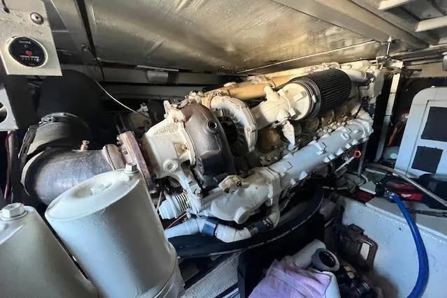 What's Next Yacht Photos Pics Engine room of a 1995 Post 50 Convertible boat, showcasing detailed machinery components.