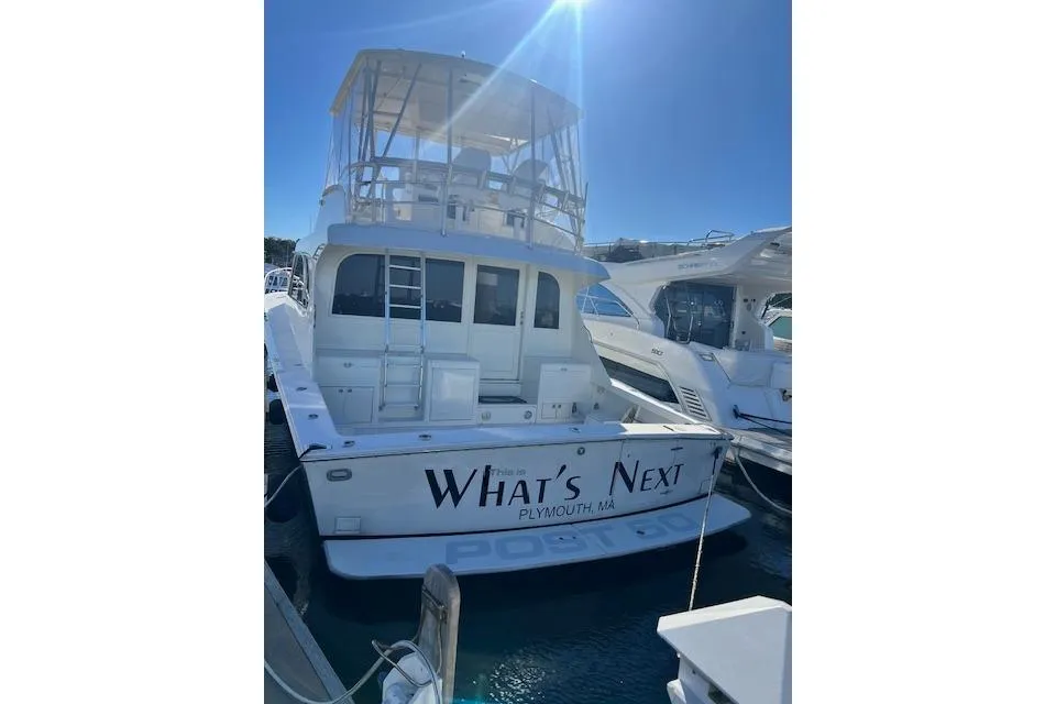 1995 Post 50 Convertible yacht named "What's Next" docked in Plymouth, MA.