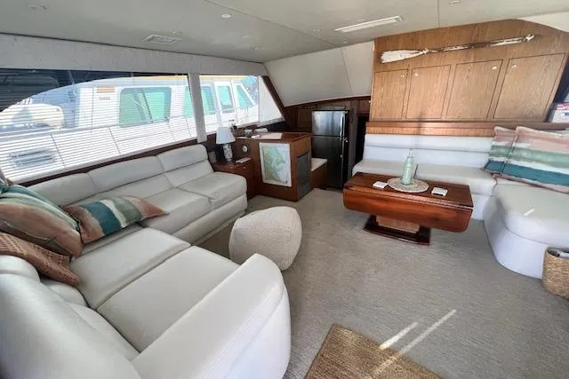 What's Next Yacht Photos Pics Luxurious interior of a 1995 Post 50 Convertible yacht with elegant seating and decor.