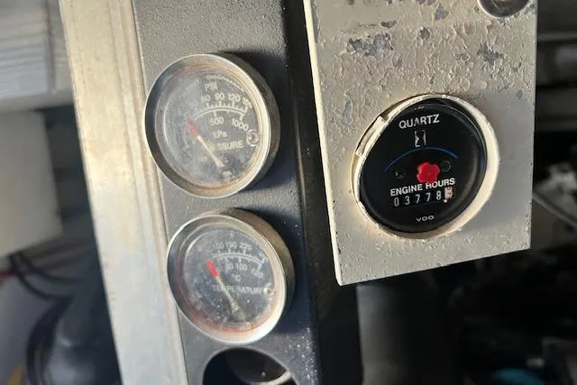 What's Next Yacht Photos Pics Close-up of 1995 Post 50 Convertible engine gauges showing pressure, temperature, and engine hours.