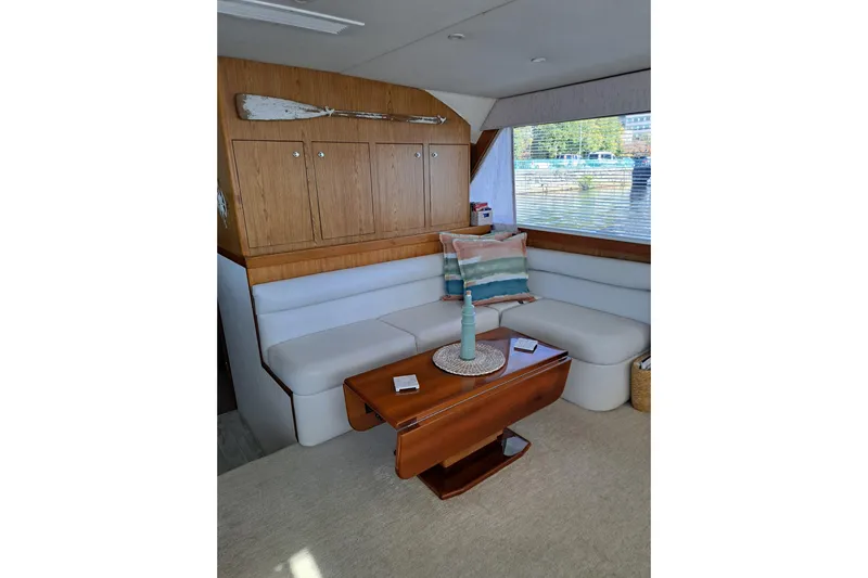 What's Next Yacht Photos Pics Luxurious 1995 Post 50 Convertible yacht interior with cozy seating and elegant decor.