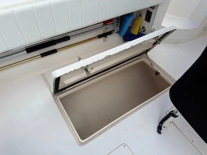  Yacht Photos Pics Open storage compartment on a 2006 Intrepid 350 Center Console boat deck.