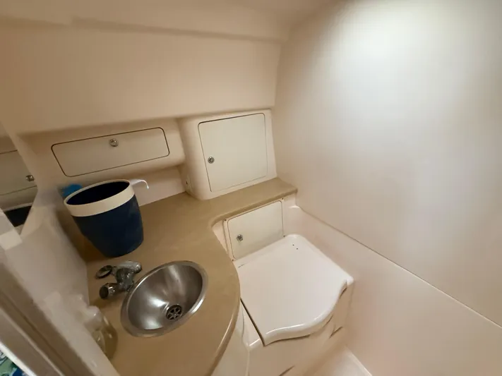  Yacht Photos Pics 2006 Intrepid 350 Center Console boat interior with sink and storage compartments.