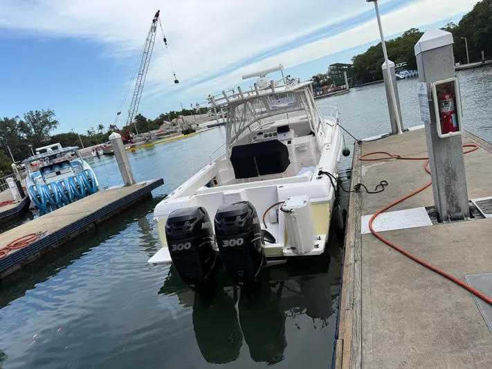  Yacht Photos Pics 2006 Intrepid 350 Center Console boat docked with dual 300 horsepower engines.