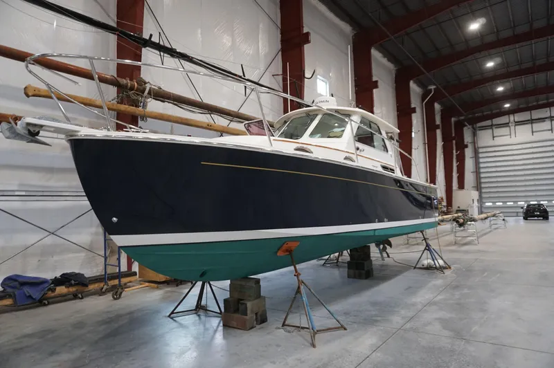 Halcyon Yacht Photos Pics 2006 Back Cove 29 boat in a spacious indoor storage facility.