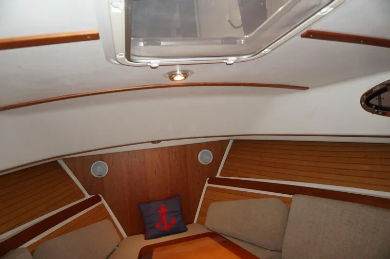 Halcyon Yacht Photos Pics Interior of 2006 Back Cove 29 boat with cozy seating and nautical decor.