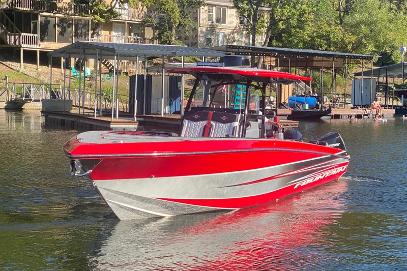  Yacht Photos Pics Red 2021 Fountain 34 SC boat docked on a sunny lake.