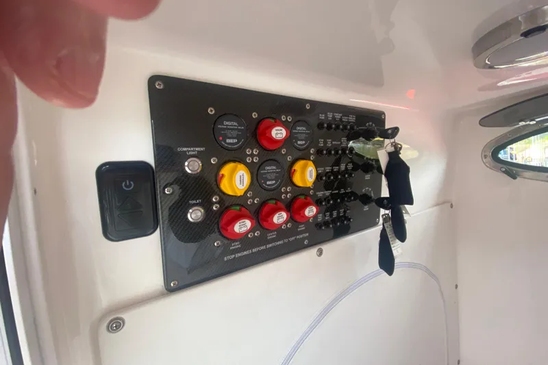  Yacht Photos Pics Control panel of 2021 Fountain 34 SC boat with switches and keys.