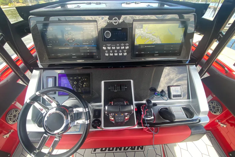  Yacht Photos Pics 2021 Fountain 34 SC boat dashboard with advanced navigation and control systems.