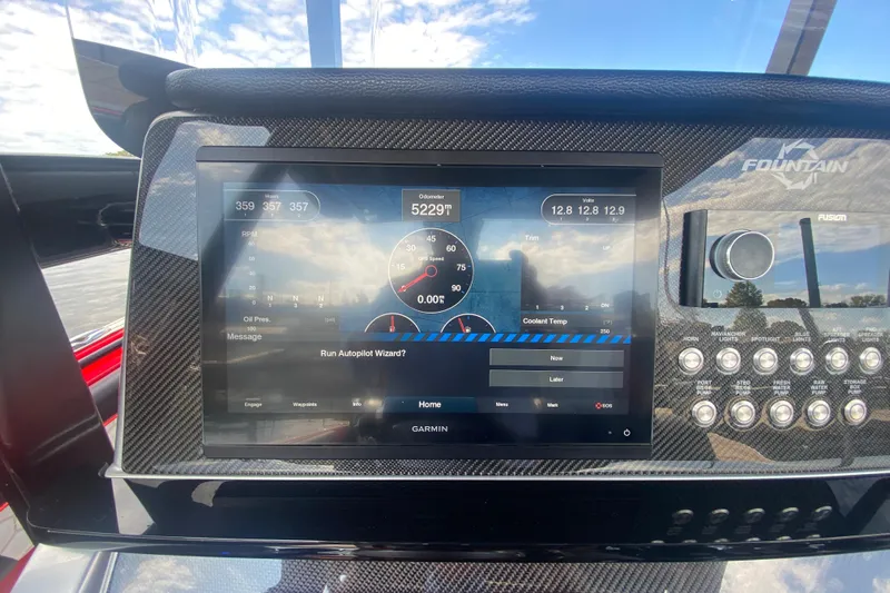  Yacht Photos Pics 2021 Fountain 34 SC dashboard with Garmin display and control panel.