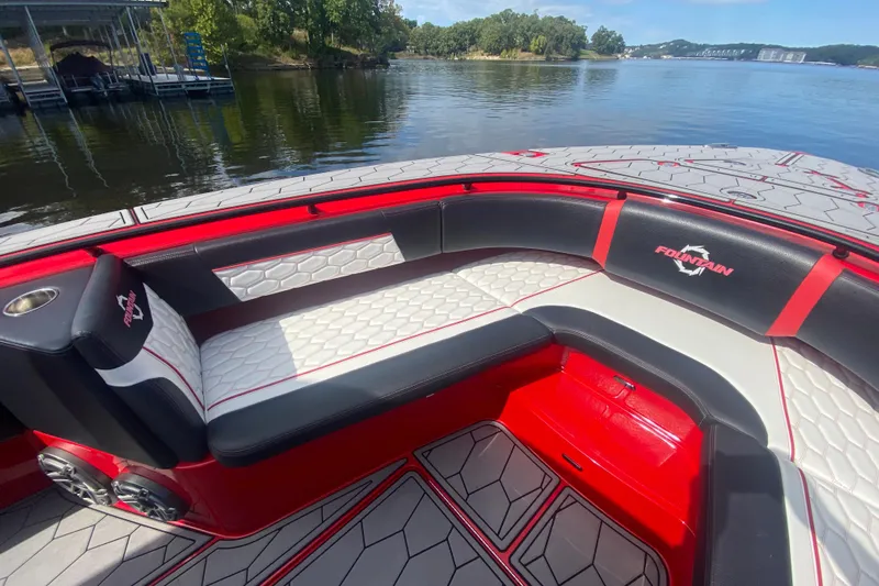  Yacht Photos Pics Luxurious seating on a 2021 Fountain 34 SC boat, featuring red and white upholstery.