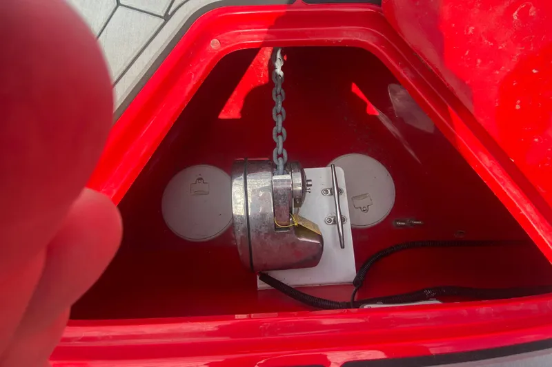  Yacht Photos Pics Anchor compartment of 2021 Fountain 34 SC boat with chain and red interior.
