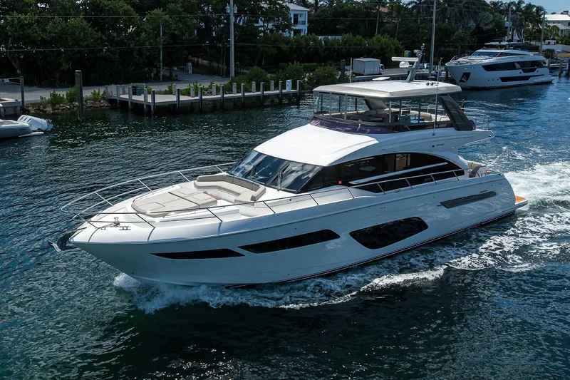 Miss Amy Yacht Photos Pics Luxurious 2020 Princess F70 yacht cruising on a serene waterway.