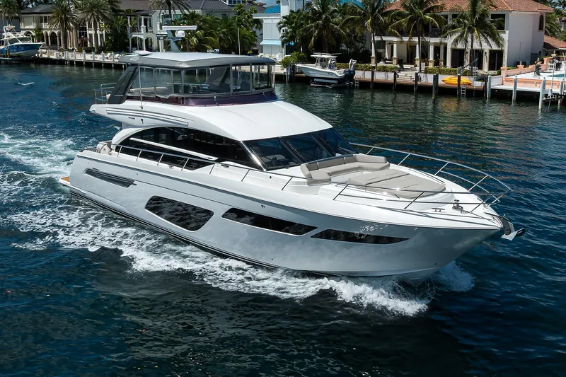 Miss Amy Yacht Photos Pics Luxury 2020 Princess F70 yacht cruising on a scenic waterfront.