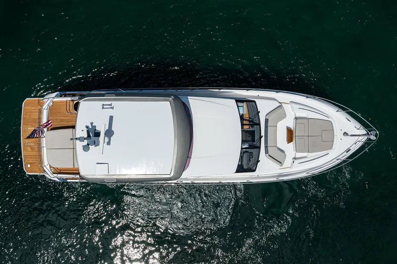 Miss Amy Yacht Photos Pics Aerial view of 2020 Princess F70 yacht on water, showcasing sleek design and spacious deck.