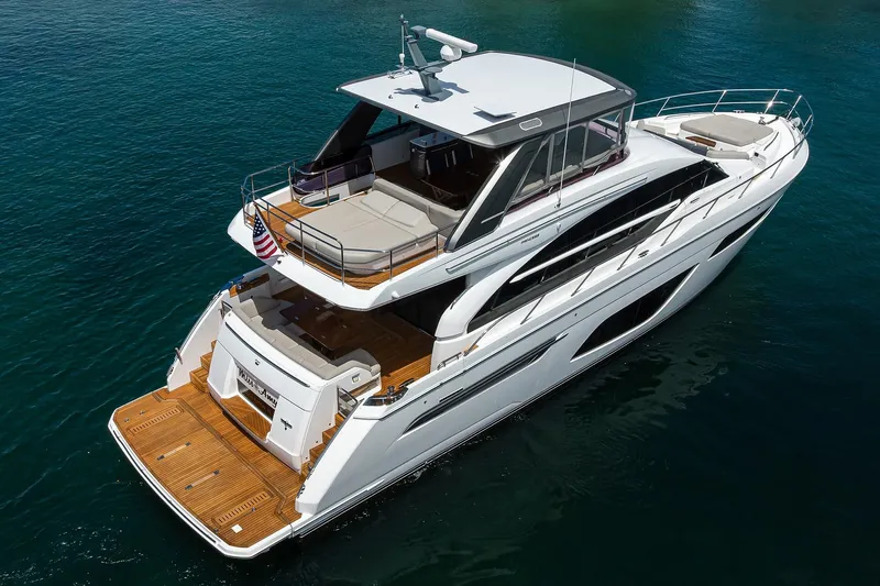 Miss Amy Yacht Photos Pics 2020 Princess F70 yacht on serene blue water, showcasing luxury design and spacious deck.