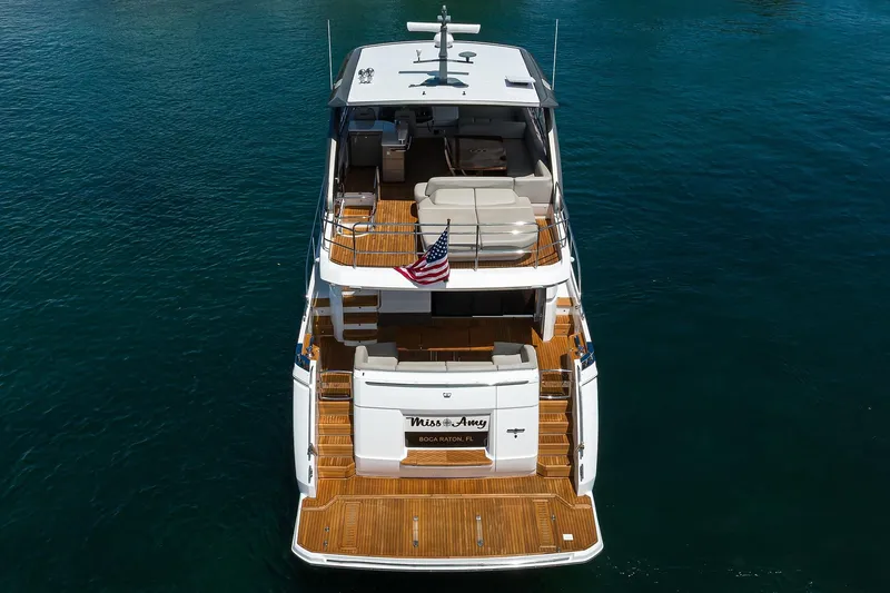 Miss Amy Yacht Photos Pics Luxury 2020 Princess F70 yacht on water, rear view with American flag.