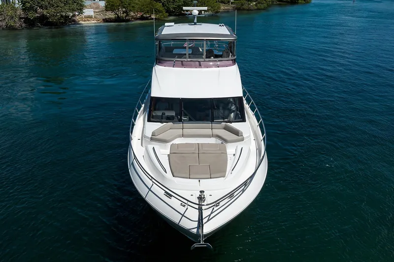 Miss Amy Yacht Photos Pics 2020 Princess F70 yacht on calm water, aerial view showcasing sleek design.