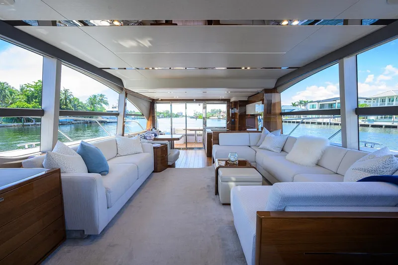 Miss Amy Yacht Photos Pics Luxurious interior of 2020 Princess F70 yacht with elegant seating and panoramic windows.