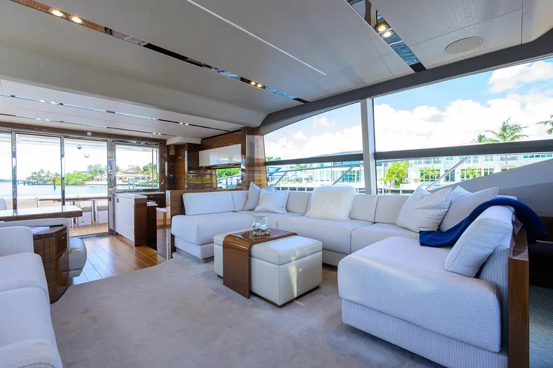 Miss Amy Yacht Photos Pics Luxurious interior of 2020 Princess F70 yacht with elegant seating and panoramic windows.