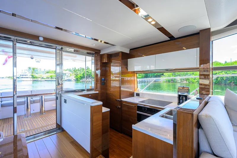 Miss Amy Yacht Photos Pics Luxurious interior of 2020 Princess F70 yacht with modern kitchen and scenic water view.