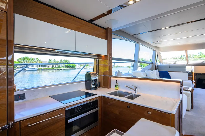 Miss Amy Yacht Photos Pics Luxurious 2020 Princess F70 yacht interior with modern kitchen and scenic water view.