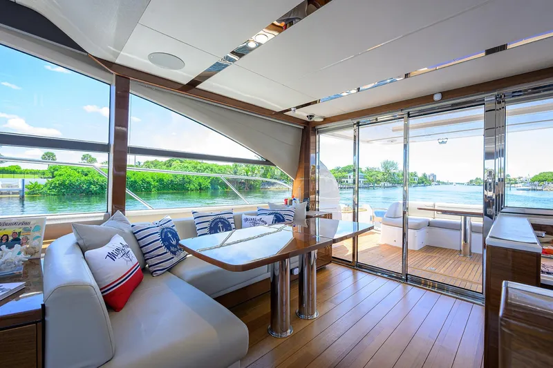 Miss Amy Yacht Photos Pics Luxurious interior of 2020 Princess F70 yacht with scenic water view through large windows.