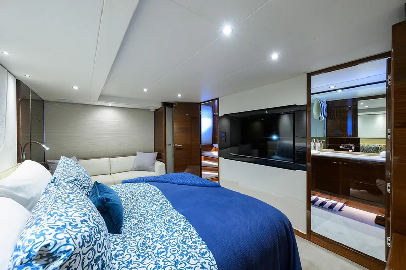 Miss Amy Yacht Photos Pics Luxurious 2020 Princess F70 yacht bedroom with elegant decor and modern amenities.