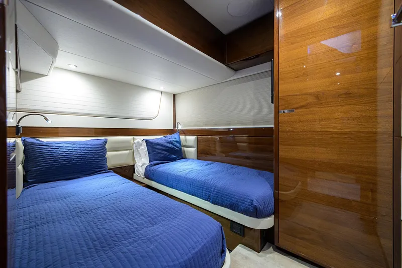 Miss Amy Yacht Photos Pics Luxurious cabin interior of 2020 Princess F70 yacht with twin beds and elegant wood finish.