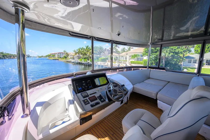 Miss Amy Yacht Photos Pics Luxurious 2020 Princess F70 yacht interior with modern helm and spacious seating area.