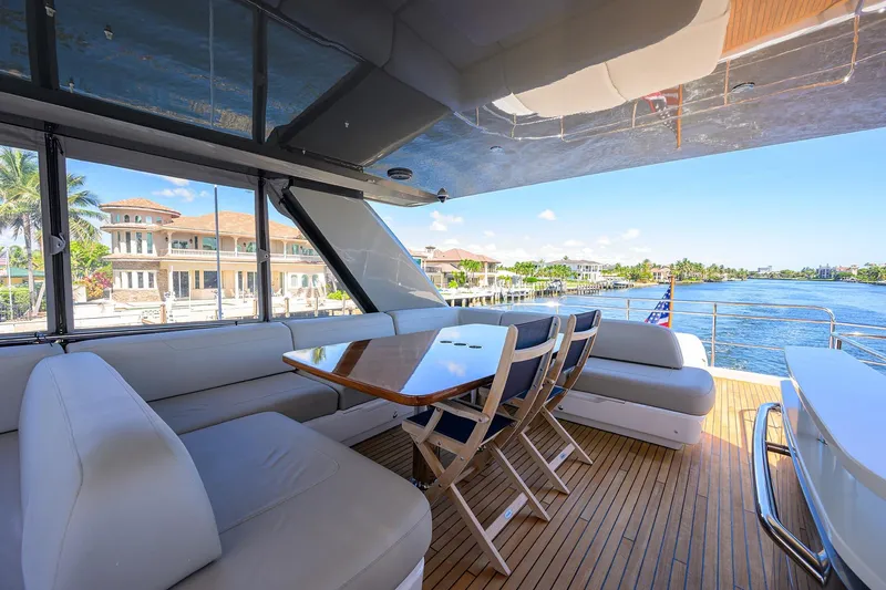 Miss Amy Yacht Photos Pics Luxurious 2020 Princess F70 yacht deck with elegant seating and waterfront view.
