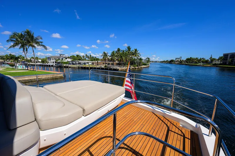 Miss Amy Yacht Photos Pics Luxurious 2020 Princess F70 yacht deck with scenic waterfront view and clear blue sky.